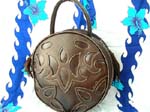 Womens handbag wholesale distributor sells Circular shaped casual purse with zippered pocket, and cute handle 