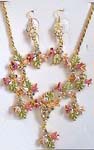Women jewelry accessory store supplier. Necklace and earring set with gold plated chain holding pink and green enamel floral design inlaid with cz gem